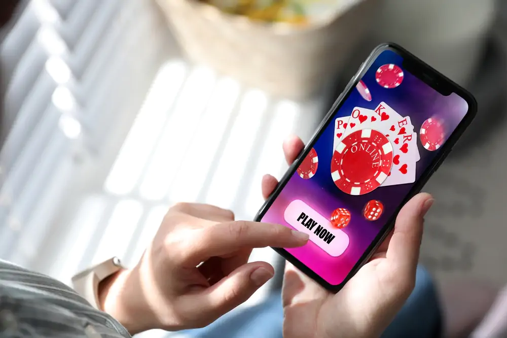 Woman,Playing,Online,Poker,On,Mobile,Phone,Indoors,,Closeup